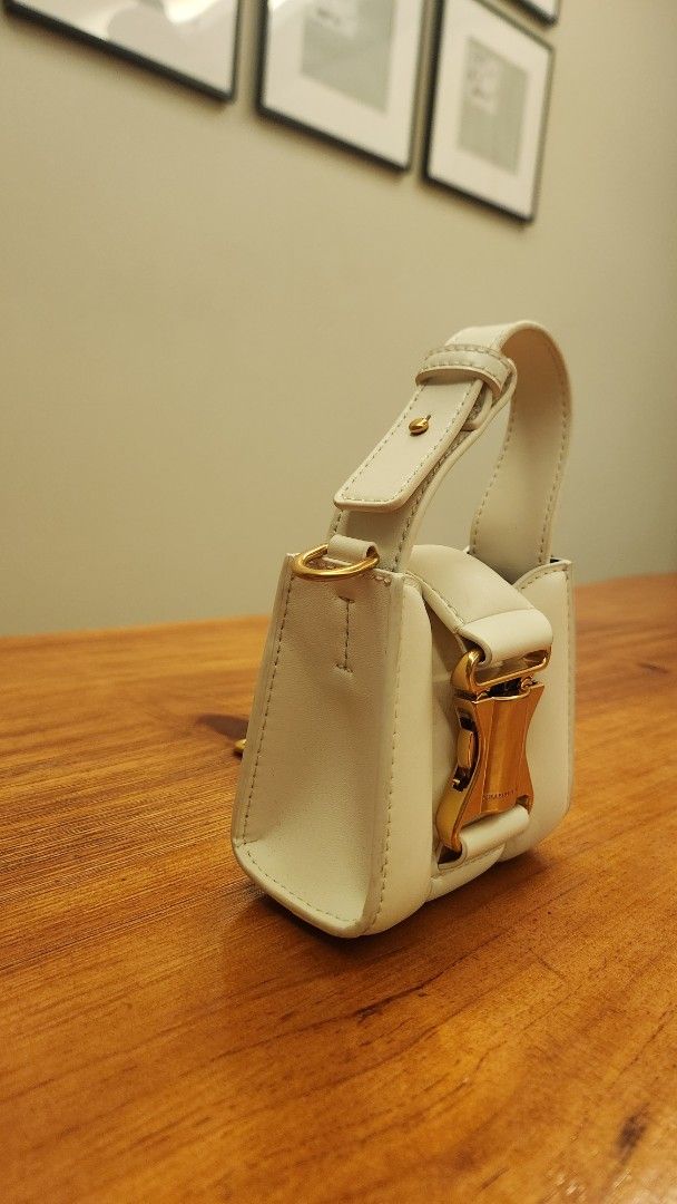 Charles & Keith Bag (Category: Purses & Pouches) located in Singapore. Submitted by kidswarrior (Listing ID 1376221775, Image 2). Description: • Ivy Top Handle Mini Bag - cream •Used once or twice • condition 8.5/10 • Meet up at Canberra mrt.