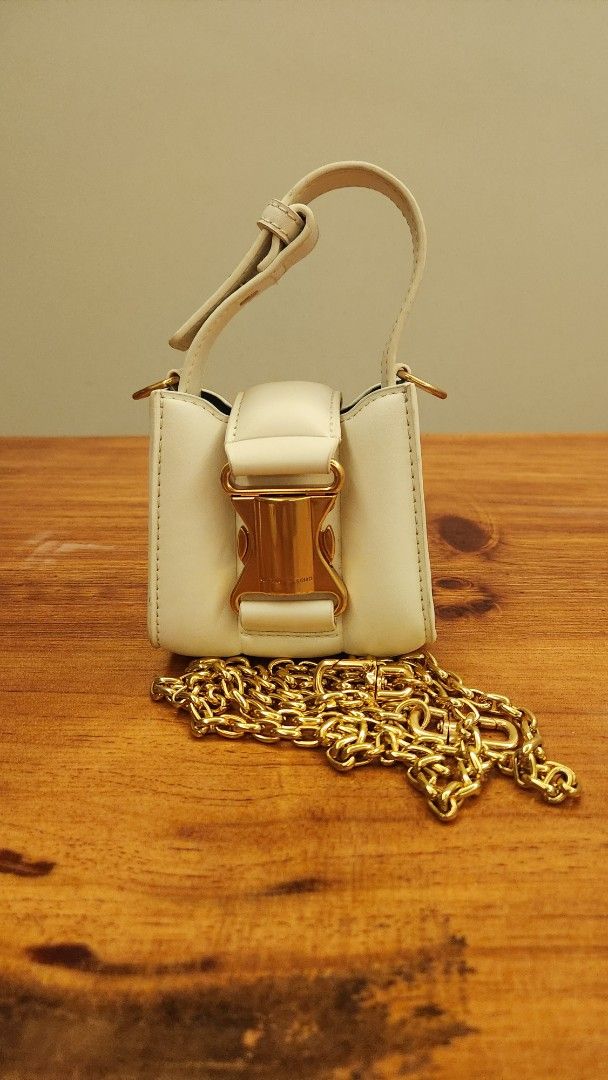 Charles & Keith Bag (Category: Purses & Pouches) located in Singapore. Submitted by kidswarrior (Listing ID 1376221775, Image 1). Description: • Ivy Top Handle Mini Bag - cream •Used once or twice • condition 8.5/10 • Meet up at Canberra mrt.
