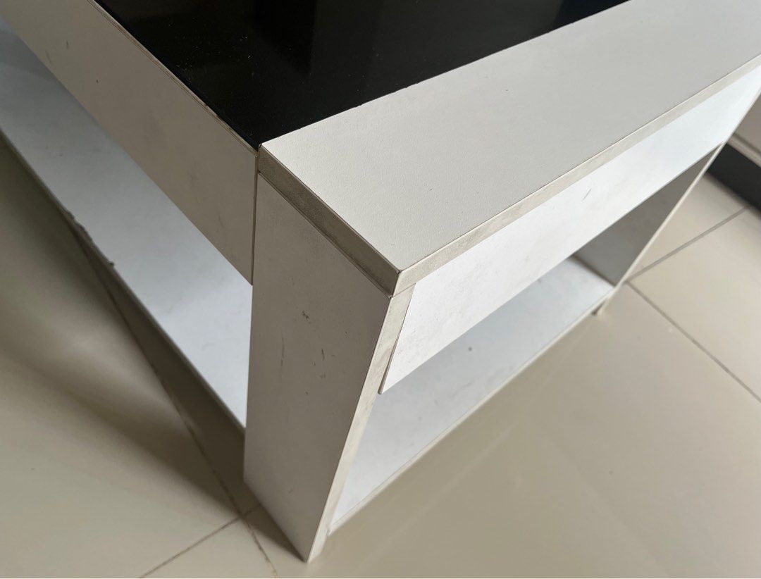 Coffee/Center Table (Category: Coffee & Tea Tableware) located in Mandaluyong City. Submitted by pepitomanaloto_777 (Listing ID 1376361662, Image 3). Description: Center/Coffee Table Used condition Top Glass Tinted ✅ No Cracks or damage sa main glass ✅ With open storage at the bottom ✅ Honest issue some discoloration (Pekas) on some parts. Not noticeable naman and doesnt affect the quality of the table. U can repaint it if you want. But the table