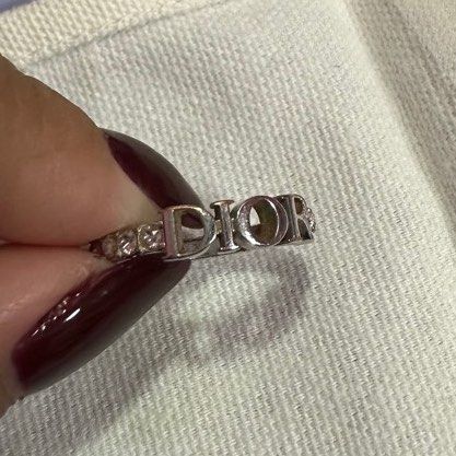 DIO(R)EVOLUTION RING (Category: Rings) located in Singapore. Submitted by wldkdl.23 (Listing ID 1254842831, Image 2). Description: Size M RTP $560 Open to trade with the gold version Ring has tarnished into a gold copper colour on some edges.