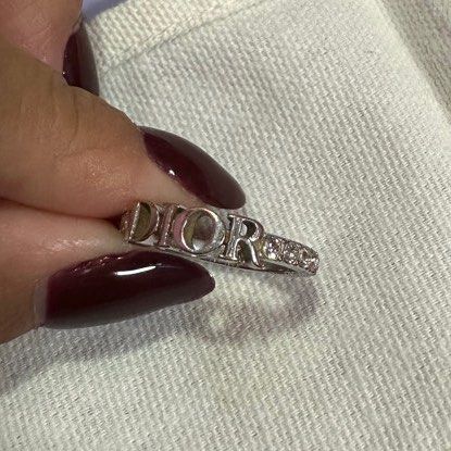 DIO(R)EVOLUTION RING (Category: Rings) located in Singapore. Submitted by wldkdl.23 (Listing ID 1254842831, Image 3). Description: Size M RTP $560 Open to trade with the gold version Ring has tarnished into a gold copper colour on some edges.