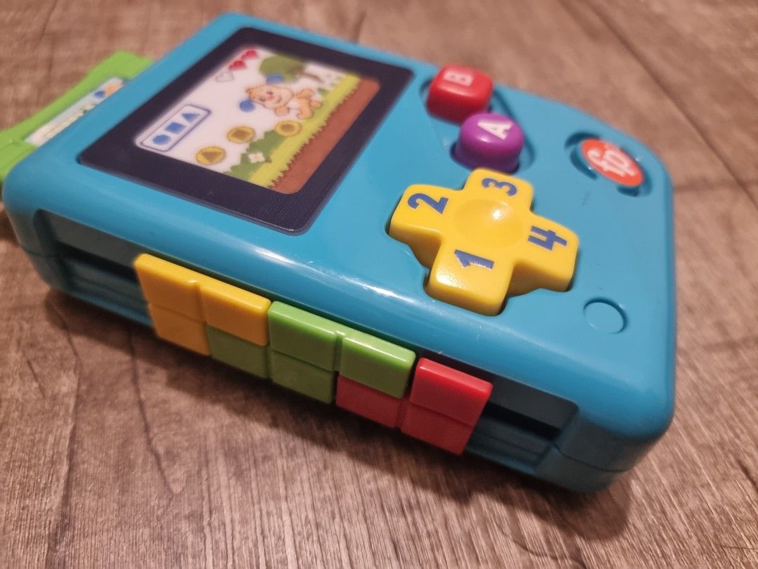 Fisher-Price Laugh & Learn Lil’ Gamer, educational musical activity toy for baby and toddlers ages 6-36mths (Category: Infant Playtime) located in Singapore. Submitted by snoozingsushi (Listing ID 1376400217, Image 3). Description: Fisher-Price Laugh & Learn Lil’ Gamer, educational musical activity toy for baby and toddlers ages 6-36mths. self collect at Yishun ave 1 or top up $6 for courier..