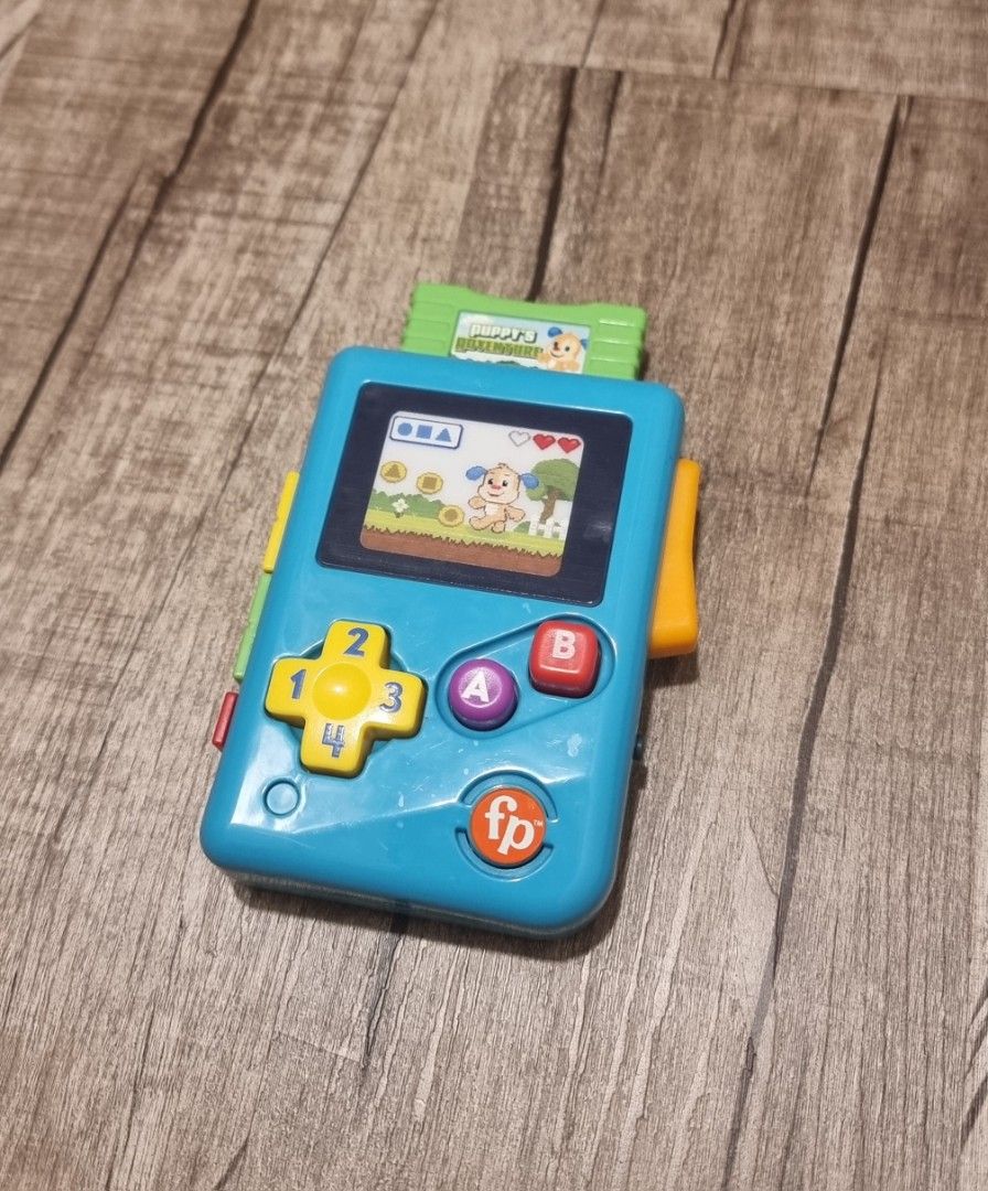 Fisher-Price Laugh & Learn Lil’ Gamer, educational musical activity toy for baby and toddlers ages 6-36mths (Category: Infant Playtime) located in Singapore. Submitted by snoozingsushi (Listing ID 1376400217, Image 1). Description: Fisher-Price Laugh & Learn Lil’ Gamer, educational musical activity toy for baby and toddlers ages 6-36mths. self collect at Yishun ave 1 or top up $6 for courier..