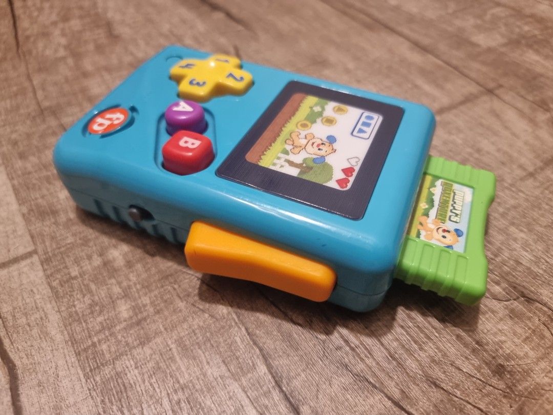 Fisher-Price Laugh & Learn Lil’ Gamer, educational musical activity toy for baby and toddlers ages 6-36mths (Category: Infant Playtime) located in Singapore. Submitted by snoozingsushi (Listing ID 1376400217, Image 2). Description: Fisher-Price Laugh & Learn Lil’ Gamer, educational musical activity toy for baby and toddlers ages 6-36mths. self collect at Yishun ave 1 or top up $6 for courier..