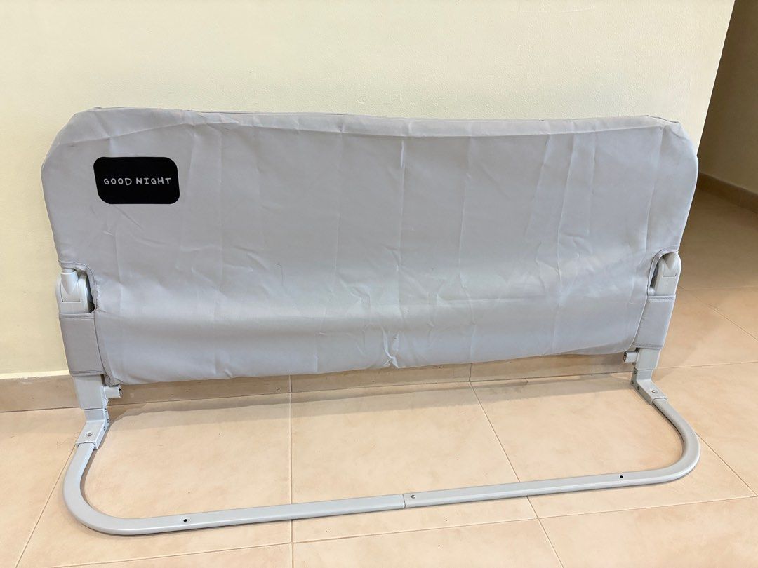 Baby Bed Rail Guard (Category: Bed Guards) located in Singapore. Submitted by kolala890 (Listing ID 1376337960, Image 1). Description: Grey fabric-covered bed rail which is removable and washable for hygiene. Features a simple, sturdy metal frame. Easy to install and dismantle. Provides safety for children in bed. Suitable for standard single beds. Compact and lightweight design. Cash and carry from my place in Punggol. Still look very new. Lengt