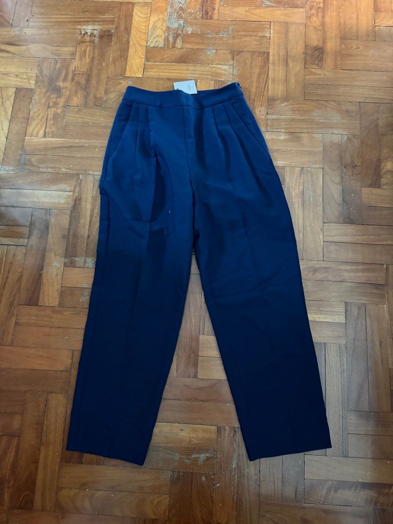 IGC Navy Summer Suiting Pippa Crop Pants (Category: Other Bottoms) located in Singapore. Submitted by okaykaya (Listing ID 1376326863, Image 3). Description: Brand new with tags IGC pants Please note the actual piece is navy, first two pictures are for reference Size XS The high-rise, straight-leg silhouette of this pair of pants hits the mark when it comes to elevated work wear essentials. Tailored from summer suiting woven with ample stretch, i