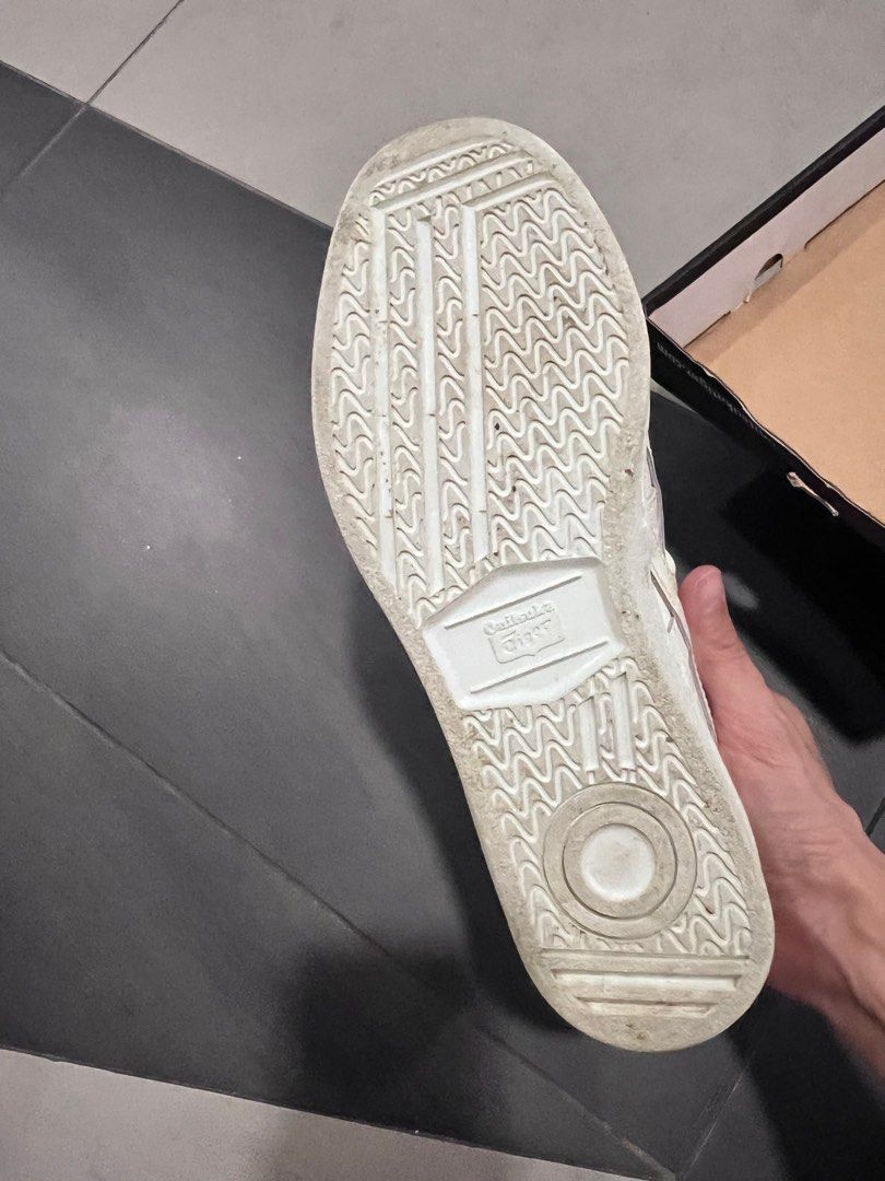 Onitsuka Tiger GSM White Sneakers Size US 6 (Category: Sneakers) located in Singapore. Submitted by youhappy (Listing ID 1376353422, Image 1). Description: Onitsuka Tiger GSM sneakers in white. US Unisex size 6, Women's size 7 1/2, Euro size 39, UK size 5. Leather upper with white laces. Comes with original box. The sole shows minimal wear..