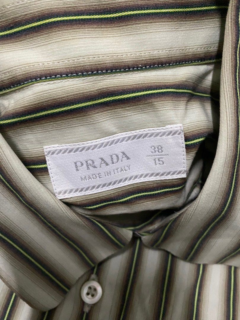 🏷️PRADA BUTTON UP STRIPED LONG SLEEVE (Category: Luxury Apparel) located in Quezon City. Submitted by angelamaec (Listing ID 1376283257, Image 3). Description: Excellent condition 20 1/2x27 sleeve length:23 Add ship.