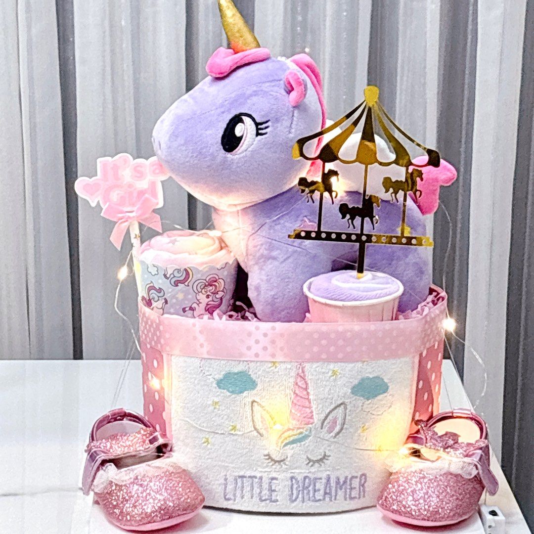 Ready stock - Unicorn Diaper Cake (Category: Diapers & Baby Wipes) located in Singapore. Submitted by silverkiwi (Listing ID 1376378950, Image 1). Description: This cake consists of: 17 S size Dryper diapers 1 Plushie 1 unicorn designed romper 1 pair of prewalker shoe 1 bib 1 washcloth Free LED lights Free card Pack in transparent gift box.