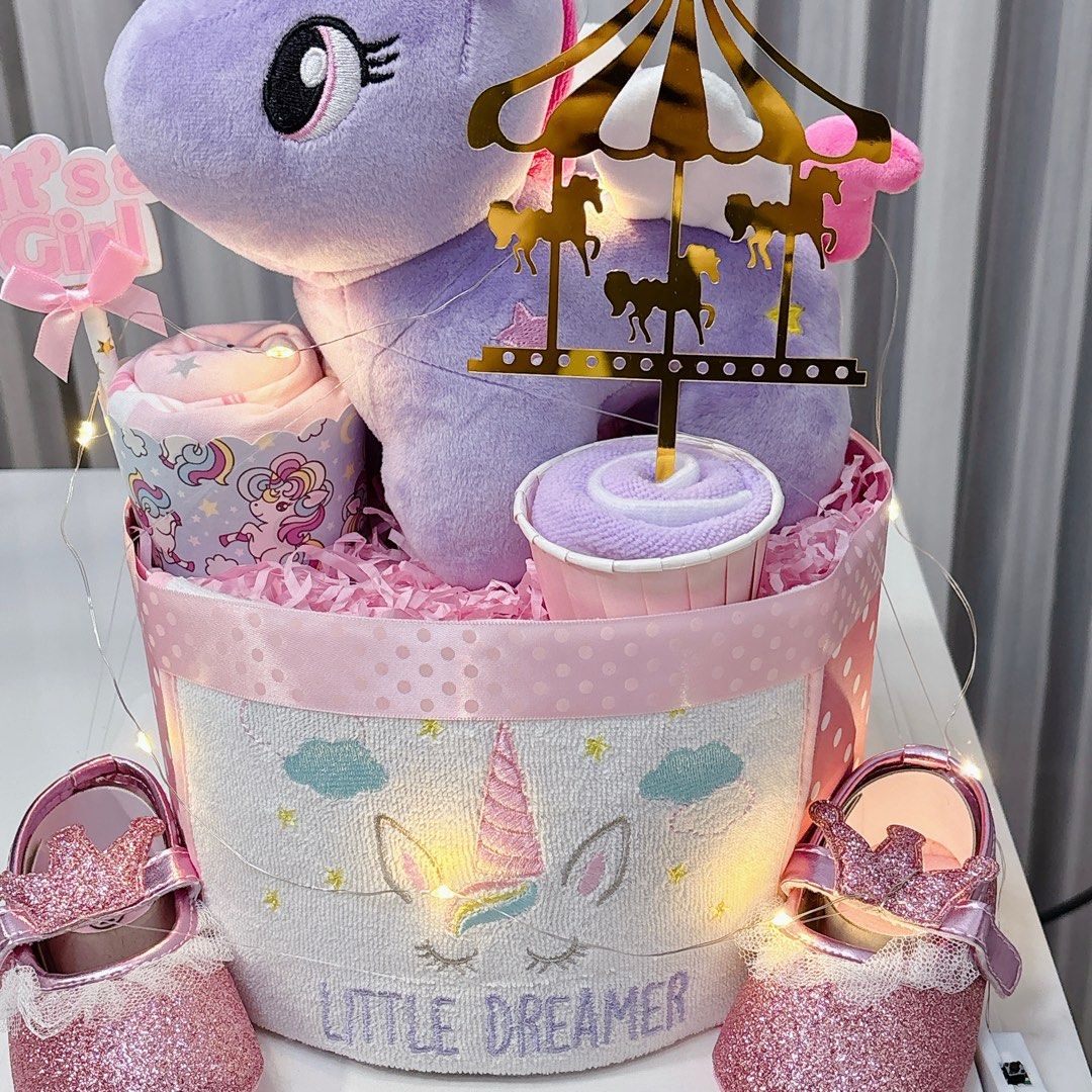 Ready stock - Unicorn Diaper Cake (Category: Diapers & Baby Wipes) located in Singapore. Submitted by silverkiwi (Listing ID 1376378950, Image 2). Description: This cake consists of: 17 S size Dryper diapers 1 Plushie 1 unicorn designed romper 1 pair of prewalker shoe 1 bib 1 washcloth Free LED lights Free card Pack in transparent gift box.