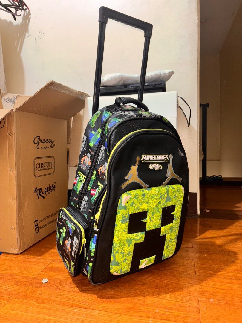 Smiggle Minecraft Trolley Bag (Category: Backpacks) located in Quezon City. Submitted by Third (Listing ID 1376333625, Image 2). Description: Smiggle Minecraft Trolley Bag -With visible signs of use but still in perfect working condition -Bought for 1800, selling for 500 -RFS: upgraded into a bigger bag -Location: Bagong Silangan, QC *last price posted 📍Checknoc main, Quezon City .