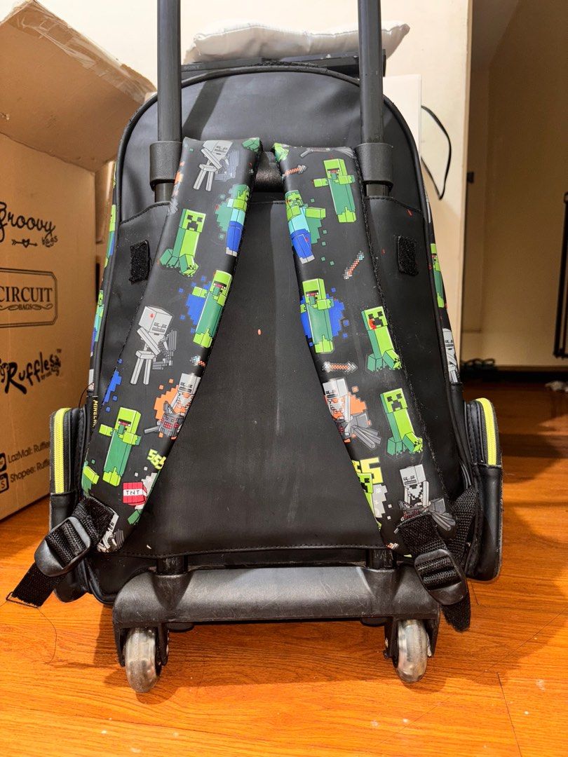 Smiggle Minecraft Trolley Bag (Category: Backpacks) located in Quezon City. Submitted by Third (Listing ID 1376333625, Image 3). Description: Smiggle Minecraft Trolley Bag -With visible signs of use but still in perfect working condition -Bought for 1800, selling for 500 -RFS: upgraded into a bigger bag -Location: Bagong Silangan, QC *last price posted 📍Checknoc main, Quezon City .