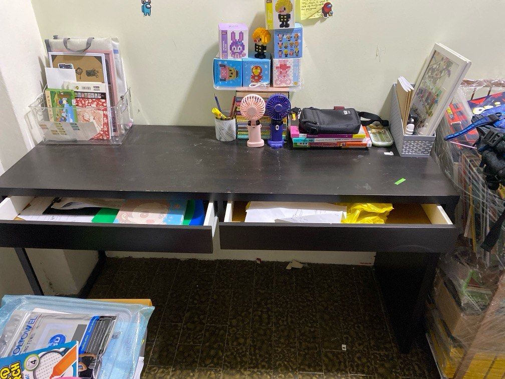 Study table (Category: Tables & Sets) located in Singapore. Submitted by lush_and_co (Listing ID 1376232918, Image 2). Description: Length 142cm Width 50cm Self collect Dark brown Good condition Not for fussy Two drawers .