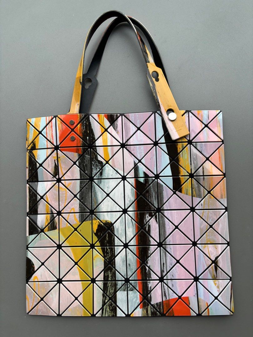 Bao Bao Issey Miyake Multicolor Gravity Paint 6x6 Tote (Category: Bags & Wallets) located in Singapore. Submitted by bagacholic (Listing ID 1376511683, Image 1). Description: Limited edition. Good condition, visible wear on inside of straps. No mark or scratch on exterior of bag..