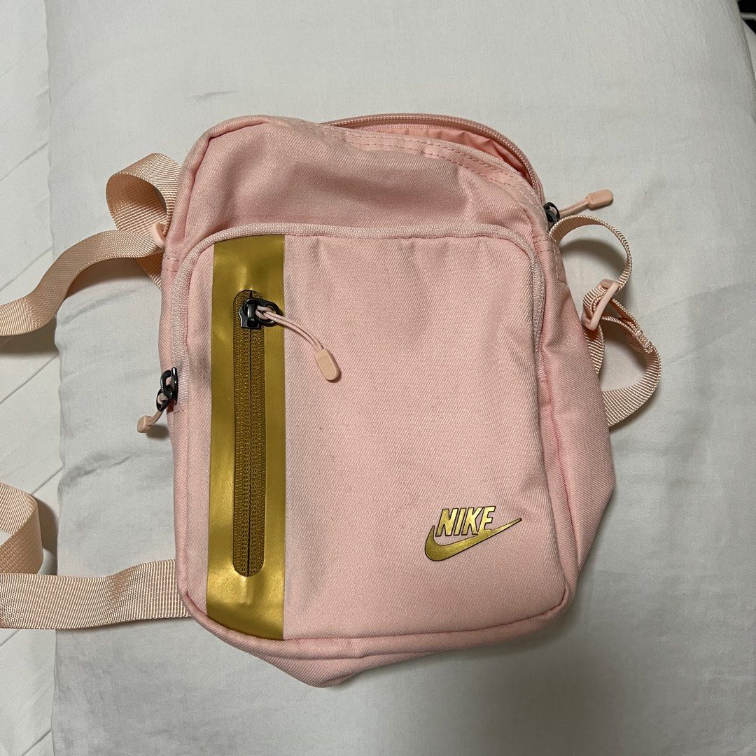Barely usedNike Small Tech Sling Bag, Original for only 400 (Category: Cross-body Bags) located in Taguig. Submitted by maykgee.1 (Listing ID 1376594345, Image 1). Description: Original Nike Sling Bag Echo Pink/ Metallic Gold 100 LEGIT - My 8 yo old daughter barely used it. Dimension: H9”xI6”xW3” 100% polyester Price - 400 Buyer shoulders shipping fee and booking courier. Item to be picked up at Acacia Estates Taguig. Pm me if interested .