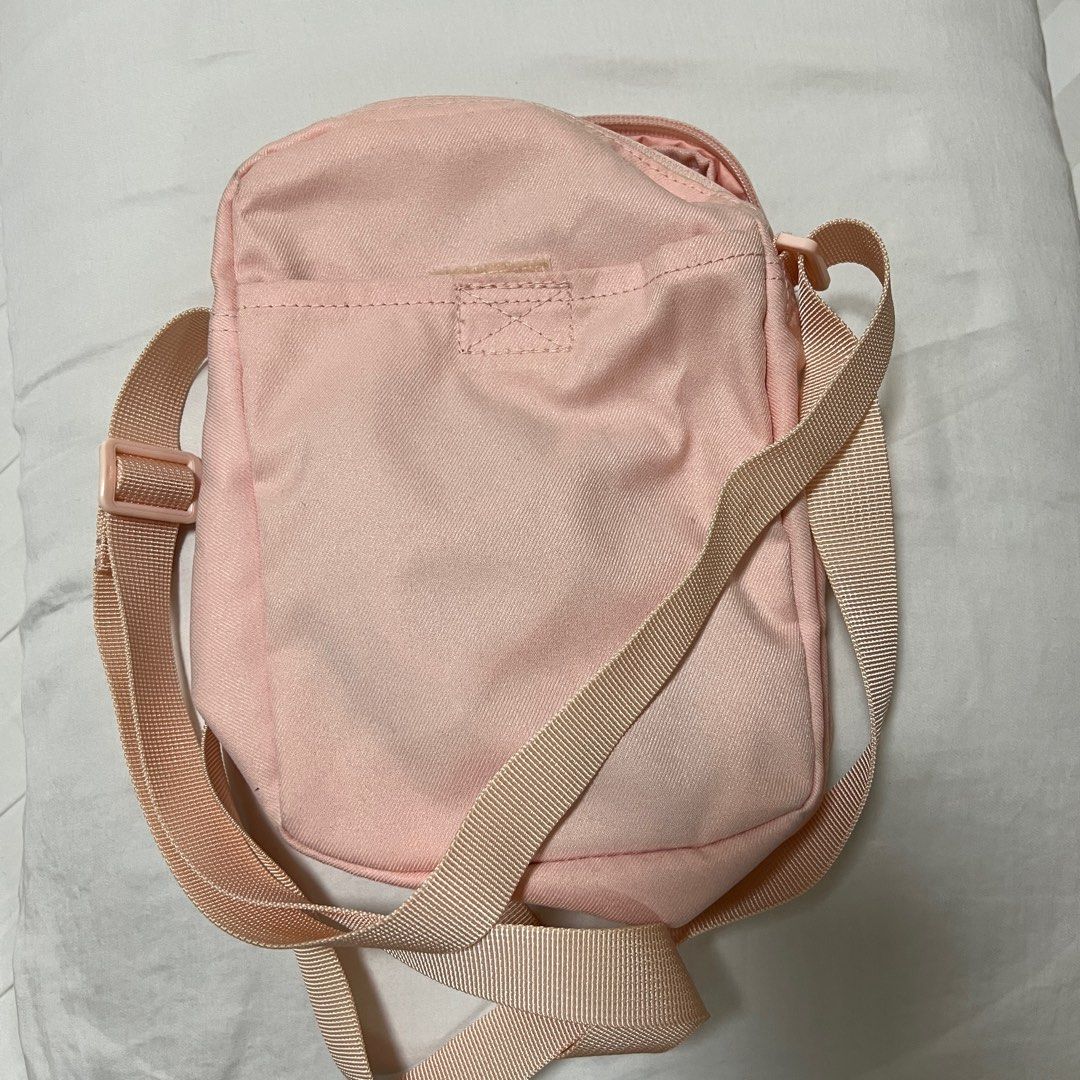 Barely usedNike Small Tech Sling Bag, Original for only 400 (Category: Cross-body Bags) located in Taguig. Submitted by maykgee.1 (Listing ID 1376594345, Image 2). Description: Original Nike Sling Bag Echo Pink/ Metallic Gold 100 LEGIT - My 8 yo old daughter barely used it. Dimension: H9”xI6”xW3” 100% polyester Price - 400 Buyer shoulders shipping fee and booking courier. Item to be picked up at Acacia Estates Taguig. Pm me if interested .