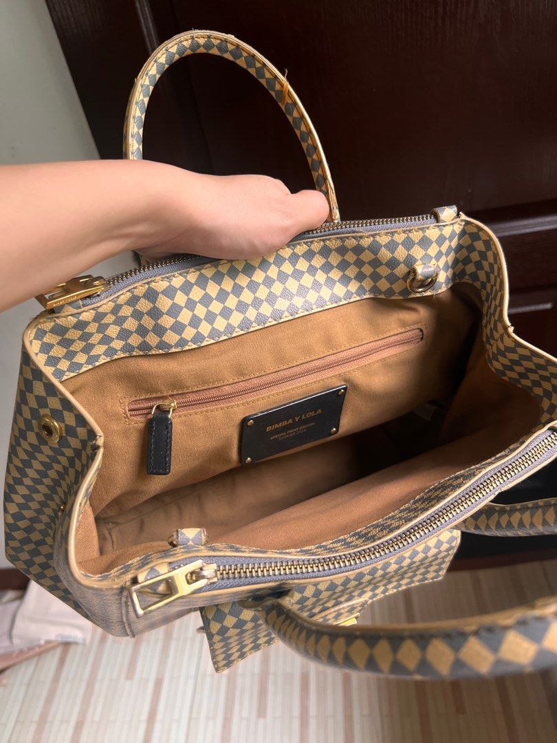 Bimba Y Lola Special Edition Handbag (Category: Luxury Bags & Wallets) located in Sorsogon. Submitted by leavingsoonsale (Listing ID 1376502806, Image 3). Description: Stylish checkered bag from Bimba Y Lola, US authentic and a special edition—perfect for collectors or fashion lovers! ✅ Spacious interior ✅ Gold-tone hardware ✅ Excellent condition (used only for law school) ✅ Authentic and hard to find Minor issue: slightly worn off rubber- lining