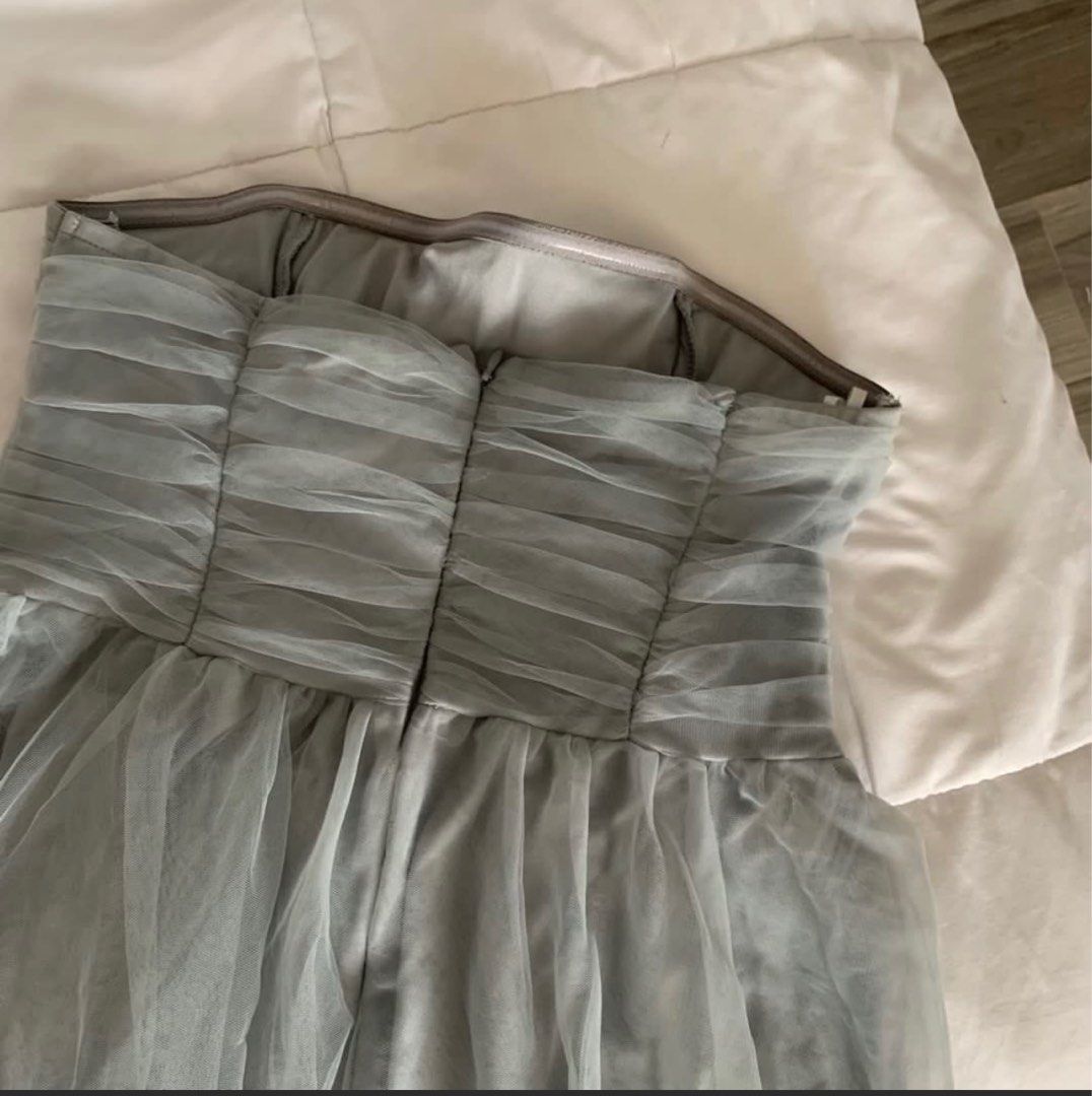 Blue Gray Long dress (Category: Evening dresses & gowns) located in Quezon City. Submitted by wantstodeclutter (Listing ID 1376601513, Image 3). Description: Medium to Semi Large Good for weddings and parties Manage your expectations as this is preloved Pick up Banawe QC Area I’m 5ft and wearing 3 inches heels on the actual pic With damages at the back zipper (see last pic).