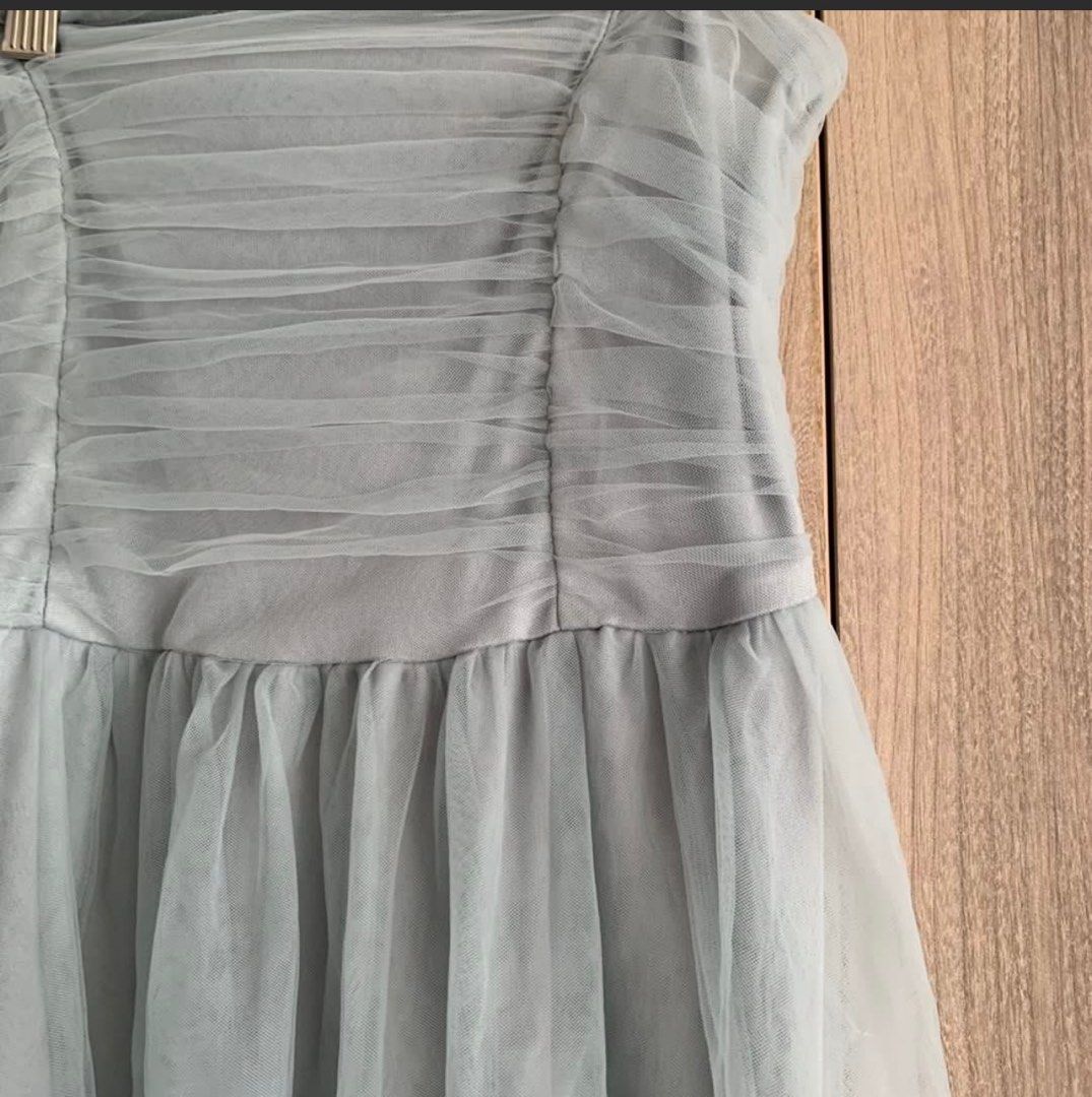 Blue Gray Long dress (Category: Evening dresses & gowns) located in Quezon City. Submitted by wantstodeclutter (Listing ID 1376601513, Image 2). Description: Medium to Semi Large Good for weddings and parties Manage your expectations as this is preloved Pick up Banawe QC Area I’m 5ft and wearing 3 inches heels on the actual pic With damages at the back zipper (see last pic).