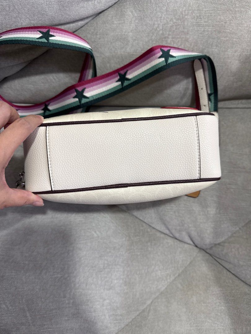Coach Boxy Shoulder Bag with Patches (Category: Bags & Wallets) located in Singapore. Submitted by kelvinlee73.1 (Listing ID 1376559016, Image 3). Description: As good as new. Condition 9.99/10. Authentic. Bought from US. Receipt faded so already threw away. Adorable Coach shoulder bag featuring a boxy design and playful patches. It has a detachable strap with stars and comes with a Coach dust bag. The bag has two main compartments with zippers a