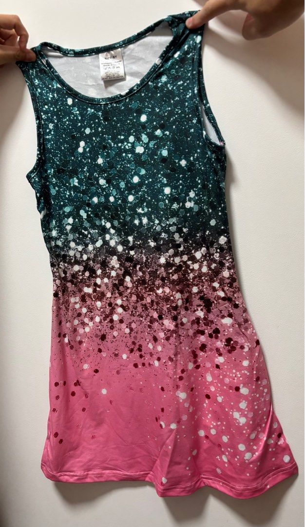Girls' ombre glitter sleeveless dress (Category: Babies & Kids Fashion) located in Singapore. Submitted by 5i3wzy1912 (Listing ID 1376596509, Image 1). Description: Adorable sleeveless dress with a beautiful ombre design. Features a dark teal to pink gradient with glitter accents. The dress has a round neckline and a relaxed fit. Perfect for parties or special occasions. .