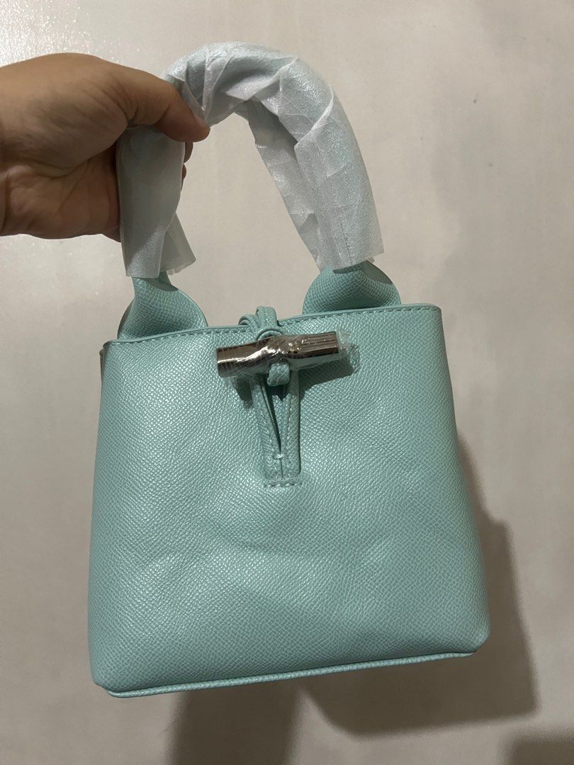 Longchamp Le Roseau S Tiffany (Category: Luxury Bags & Wallets) located in Quezon City. Submitted by hollyyybac25473 (Listing ID 1376507010, Image 1). Description: Longchamp Le Roseau Size: S Color: Tiffany w/ sling & dustbag Rfs: will keep black ver. Actual photos posted. Can still nego for sure buyer. 📍East ave, QC.