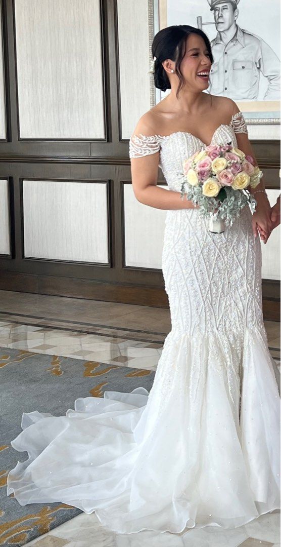 Mermaid wedding gown with sleeves (Category: Evening dresses & gowns) located in Makati City. Submitted by getinstyle (Listing ID 1376429900, Image 2). Description: Used last May 31, 2025 Got so many compliments from guests Waist 27 Please refer to the last photo for more detailed measurements .