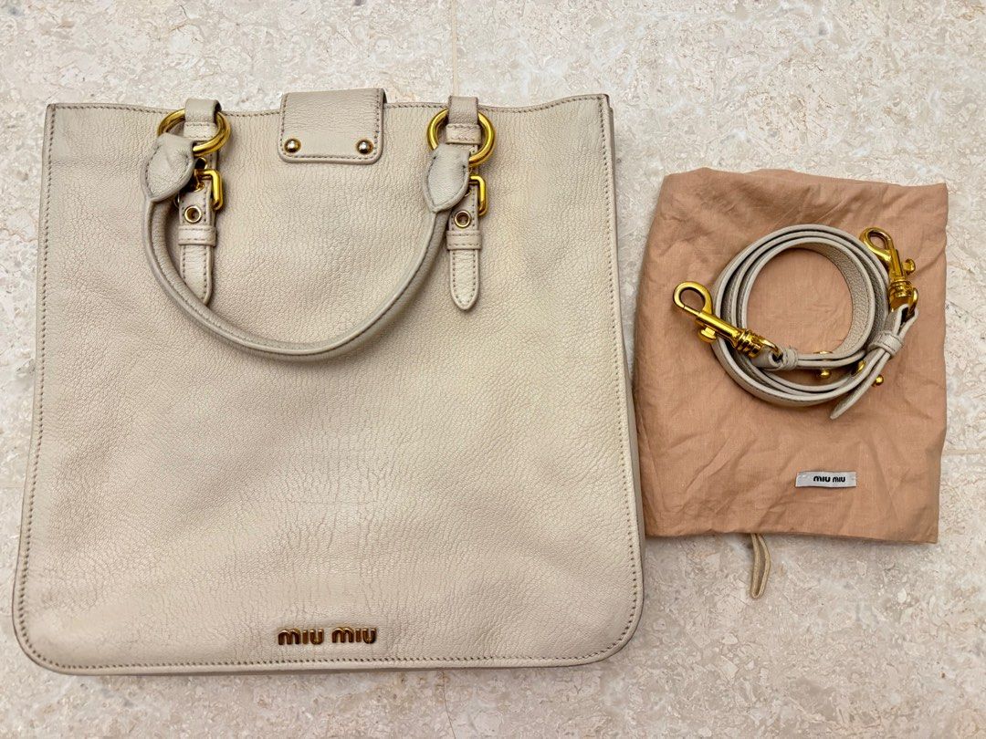 Miu Miu calfskin buckle top handle sling bag (Category: Bags & Wallets) located in Singapore. Submitted by whereabouts (Listing ID 1376564366, Image 2). Description: Come with long strap and dust bag only .