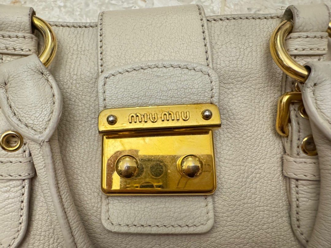 Miu Miu calfskin buckle top handle sling bag (Category: Bags & Wallets) located in Singapore. Submitted by whereabouts (Listing ID 1376564366, Image 3). Description: Come with long strap and dust bag only .