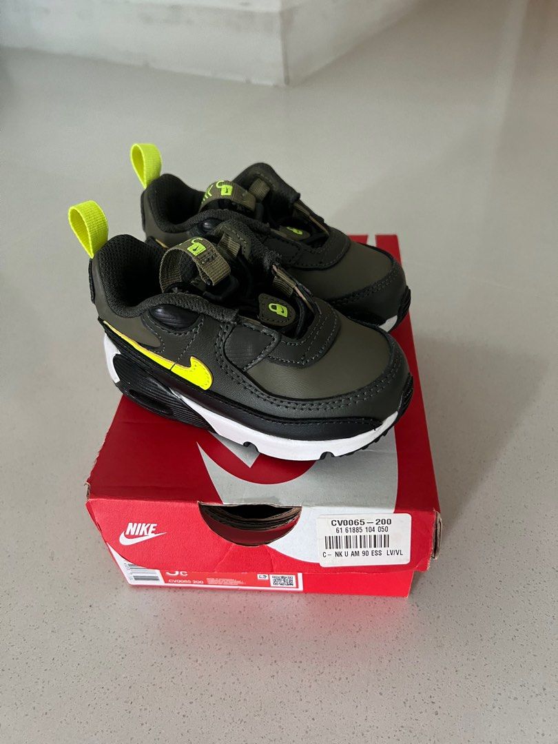 Nike Air Max 90 for baby size 5C (Category: Babies & Kids Fashion) located in Singapore. Submitted by loongstoryshort (Listing ID 1376486071, Image 1). Description: Nike Air Max 90 ESS sneakers for infants. Olive green with neon yellow accents. Worn few times. Size 5C. Pickup from 439958 with box. Retails $100+.