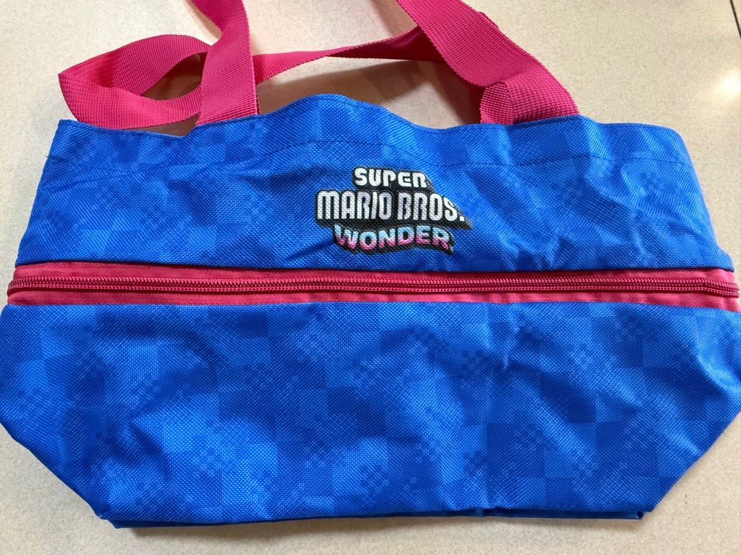 Nintendo Switch Super MariosExpandable Bros Shopping Bag (Category: Tote Bags) located in San Juan City. Submitted by knickscorner (Listing ID 1376442794, Image 2). Description: Product: Super Mario Bros. Wonder Expandable Shopping Bag Material: Oxford cloth, metal parts Size: 37(w) x 31(h) x 12(d) cm / 37(w) x 19(h) x 12(d) cm (folded) .