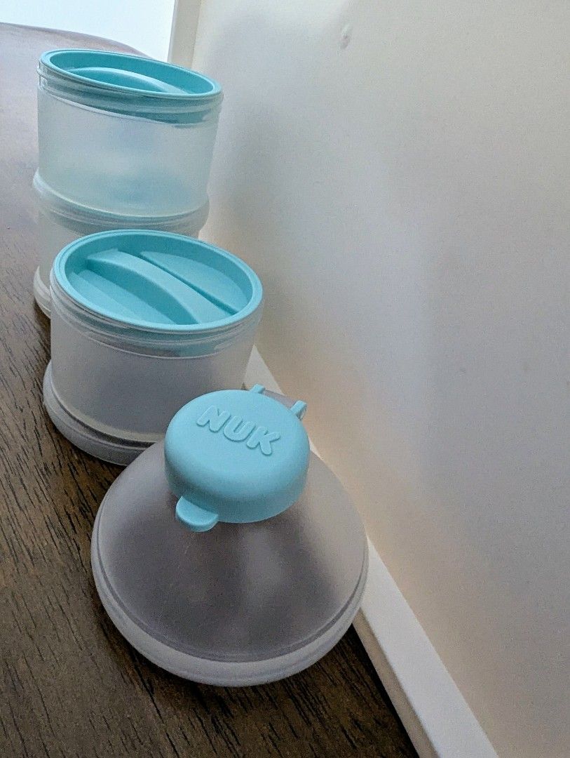 NUK Milk Powder Dispenser (Category: Breastfeeding & Bottle Feeding) located in Singapore. Submitted by JoAnne (Listing ID 1376432073, Image 1). Description: NUK milk powder dispenser. Light blue lid, translucent container. 3 stack and join containers for 3 portions. Easy to use, clean, and perfect for on-the-go formula feeding..