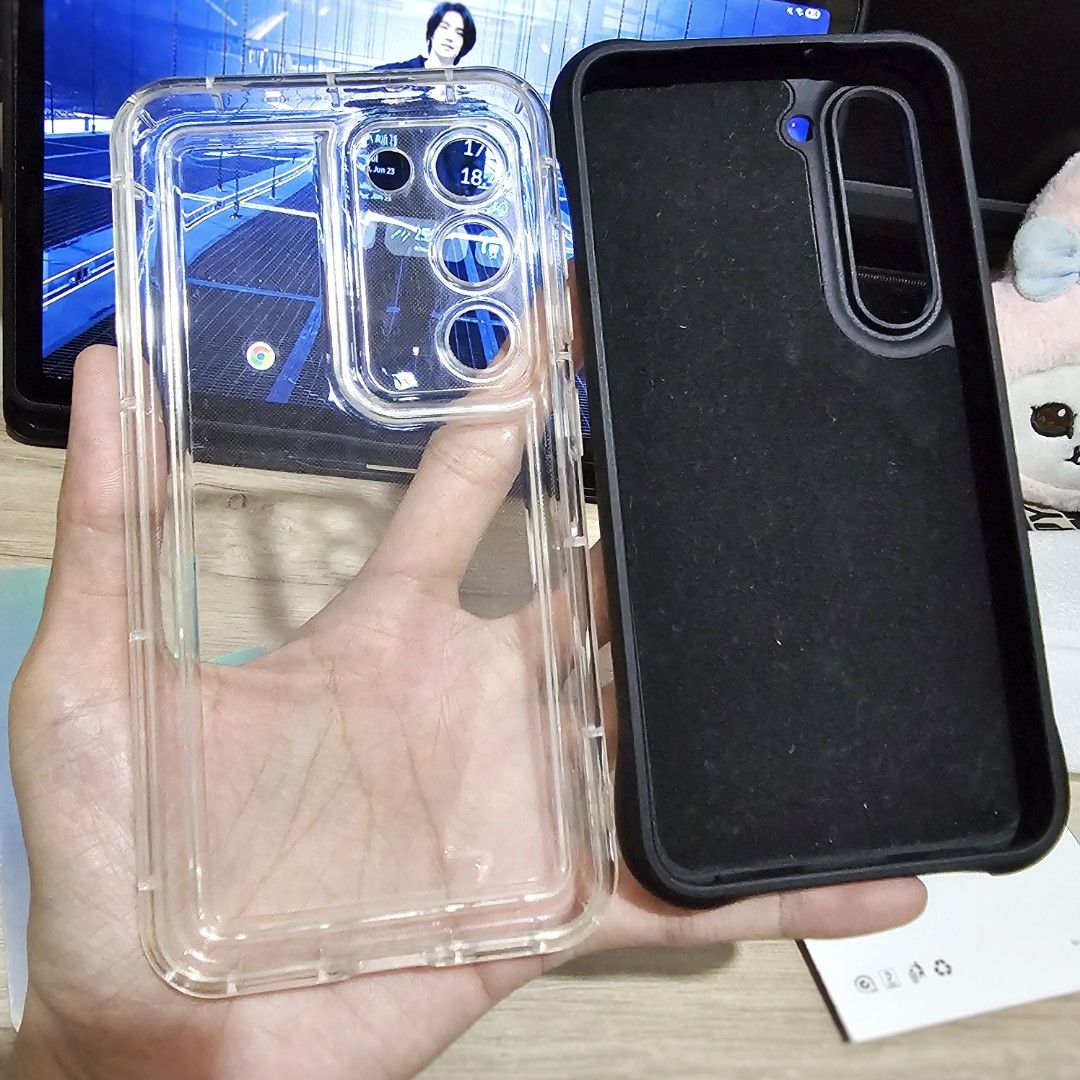 S23 phone cases (Category: Cases & Sleeves) located in Makati City. Submitted by randomelle (Listing ID 1376527021, Image 2). Description: Available while posted RFS changed phone Php100 - (1)black ripple case, magnetic and matte: no damage or peeling, 90% clean, need constant polishing but really loved this one. Php120 - (1)clear with unused holo non-stick film: slightly used, quite new, no damage, 95% smooth..
