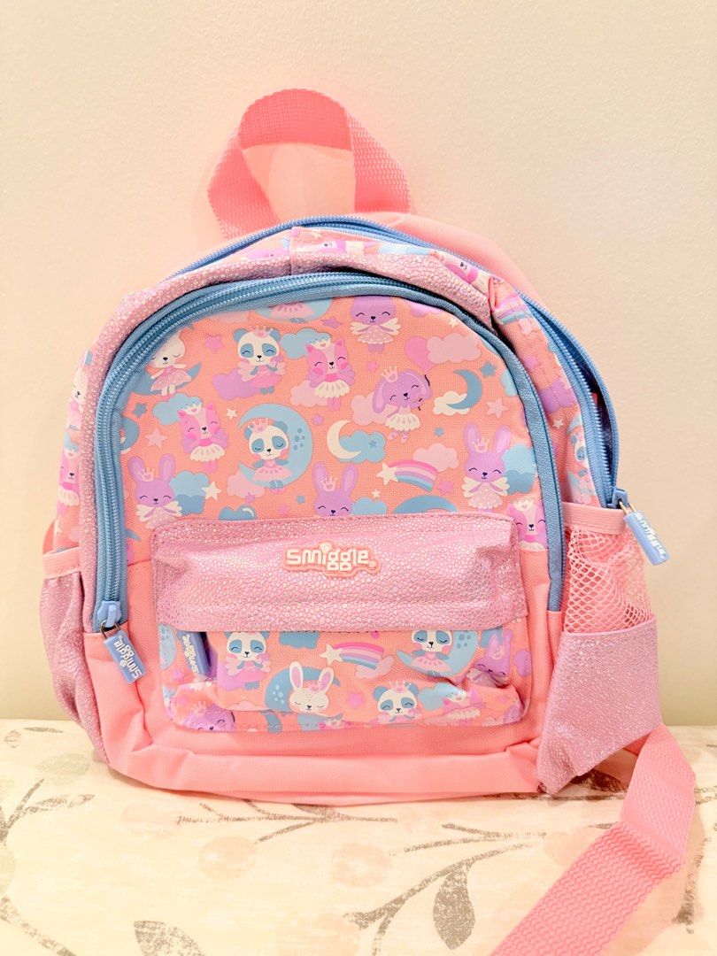 Smiggle Wink Teeny Tiny Backpack (Category: Backpacks) located in Santa Maria. Submitted by stuff4less07 (Listing ID 1376534030, Image 1). Description: Smiggle Singapore This super cute backpack from the Wink collection is perfect for preschool and toddlers. Three zipped compartments - main compartment with double zips Dual drink bottle sleeves Padded adjustable shoulder straps Carry handle Internal slip pocket Internal name label Polyester (cove