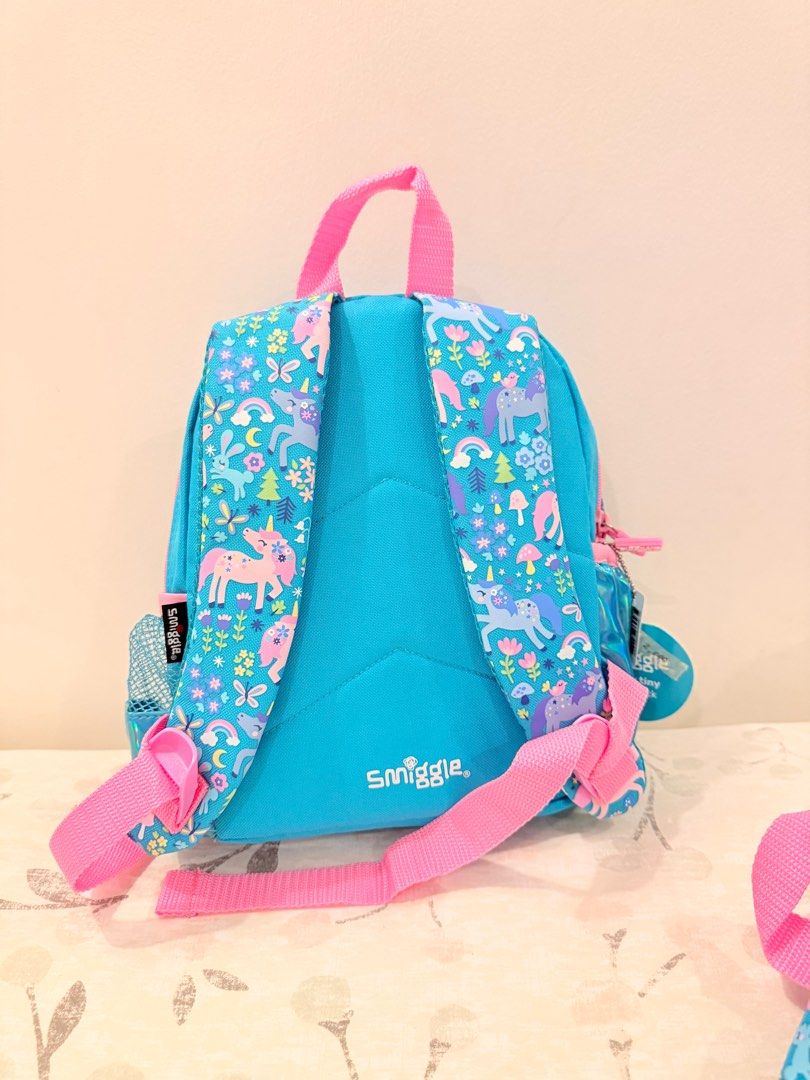 Teeny tiny topsy unicorn Smiggle backpack (Category: Backpacks) located in Santa Maria. Submitted by stuff4less07 (Listing ID 1376538420, Image 2). Description: Wink collection is perfect for preschool and toddlers. * Three zipped compartments - main compartment with double zips * Dual drink bottle sleeves * Padded adjustable shoulder straps * Carry handle * Internal slip pocket * Internal name label * Polyester (cover and lining) * Polyethylene 