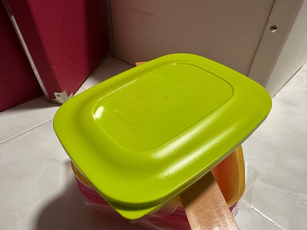 Tupperware Containers (Category: Other Kitchenware & Tableware) located in Singapore. Submitted by fattybombom37 (Listing ID 1376565757, Image 2). Description: BRAND NEW ITEM FOR SALE $5 EACH 4 COLOURS AVAILABLE 16cm x 12cm PM NOW FOR FAST DEAL MANY TUPPERWARE ITEMS FOR SALE.