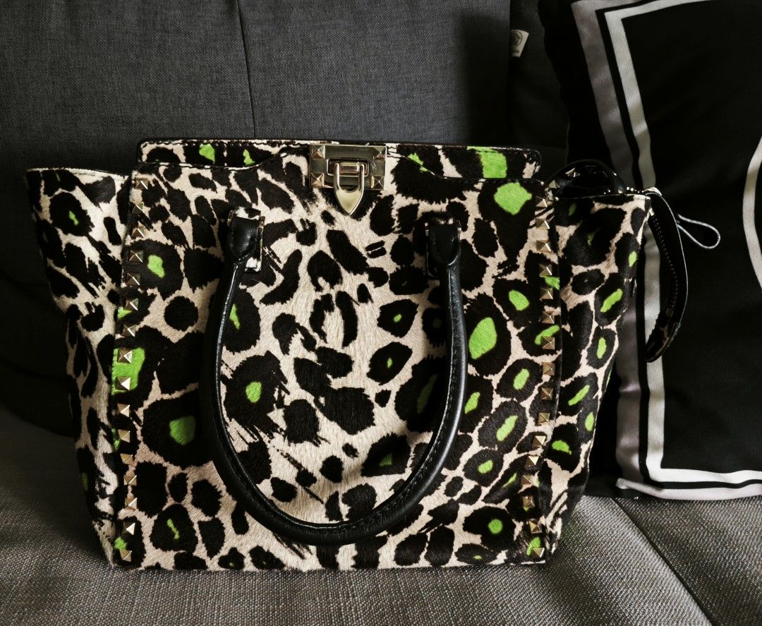 Valentino Garavani bag (Category: Bags & Wallets) located in Singapore. Submitted by piecesofvivian (Listing ID 1376432651, Image 1). Description: - Clearing as seldom use after purchase in 2019. - Unique pony hair, rock studded,leopard print. - Hand and shoulder carry with long studded strap. - No visible defect. - Bag itself..