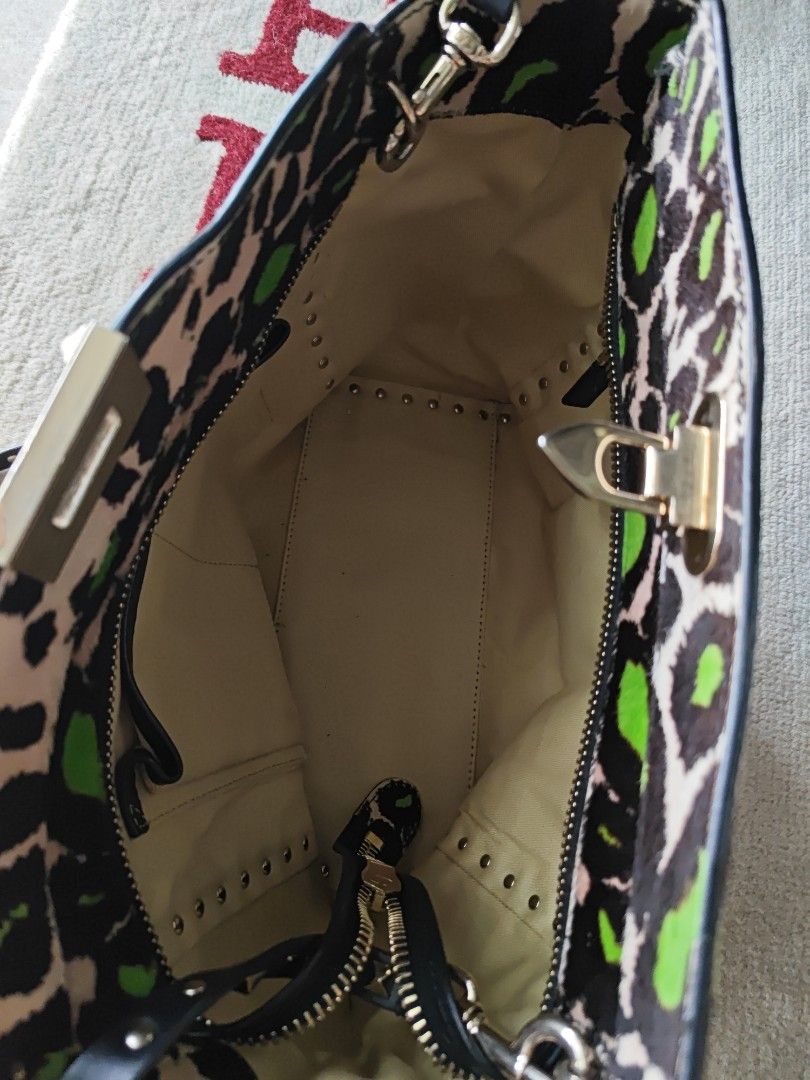 Valentino Garavani bag (Category: Bags & Wallets) located in Singapore. Submitted by piecesofvivian (Listing ID 1376432651, Image 3). Description: - Clearing as seldom use after purchase in 2019. - Unique pony hair, rock studded,leopard print. - Hand and shoulder carry with long studded strap. - No visible defect. - Bag itself..
