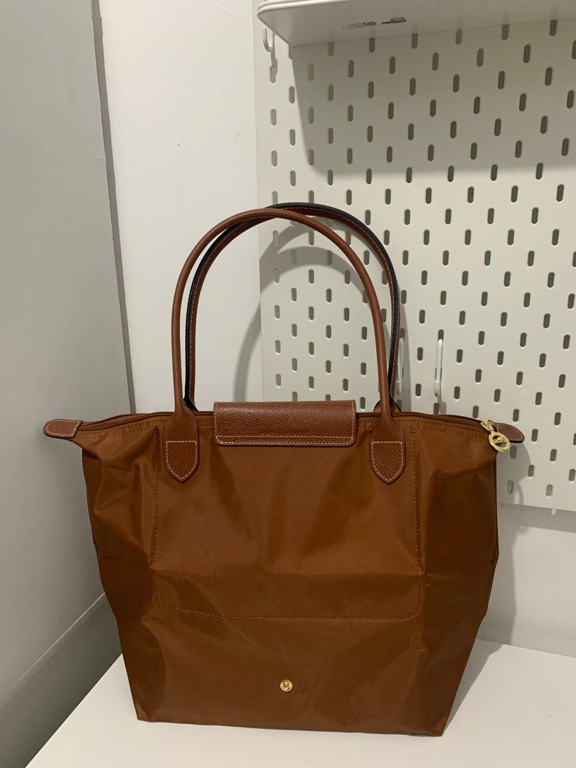 Large Longchamp Le Pliage in Cognac (Category: Luxury Bags & Wallets) located in Manila. Submitted by _girlfinds (Listing ID 1376626784, Image 3). Description: 👜 LONGCHAMP LE PLIAGE – JAPAN SOURCED Elevate your daily style with this classic and functional Longchamp tote. 📍 Sourced directly from Japan – self authentication with the provided photos, premium quality. Now with RARE COLORS included! ✔️ Rare or hard-to-find shades ✔️ High demand, low