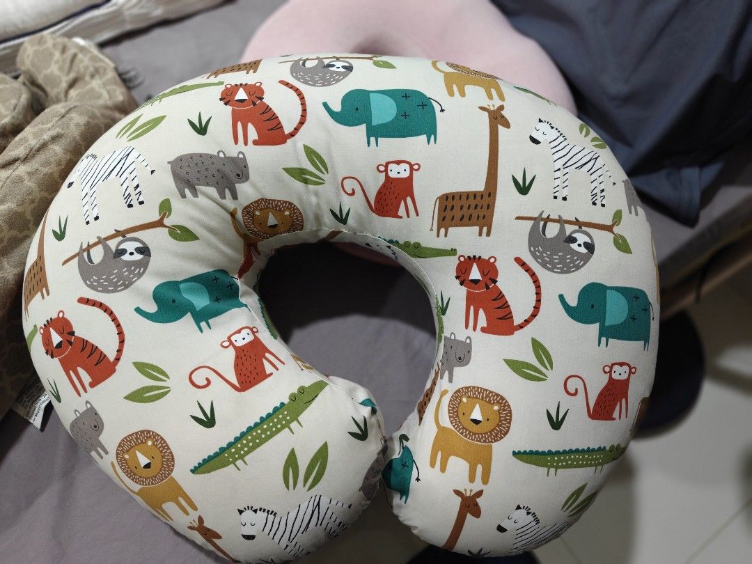 Original Poppy Animal Print Nursing Pillow (Category: Breastfeeding & Bottle Feeding) located in Singapore. Submitted by akinarah (Listing ID 1376689105, Image 1). Description: Cream-colored nursing pillow with jungle animal print. U-shaped design for comfortable feeding support for both mom and baby..