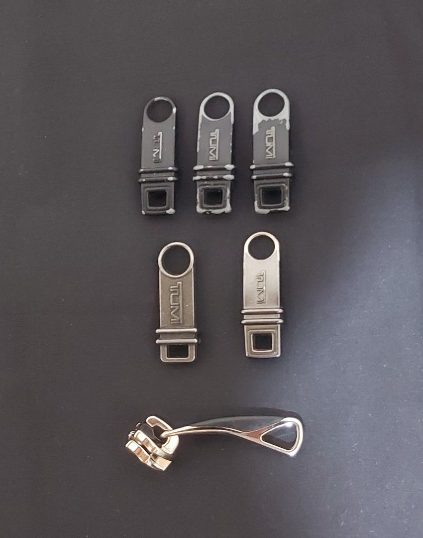 Original TUMI Industrial Type Metal Zipper Pullers (Category: Luxury Accessories) located in Pasay City. Submitted by itemsforsale00 (Listing ID 1376803381, Image 1). Description: - 500 each puller - Original TUMI Industrial Type Metal Zipper Pullers.