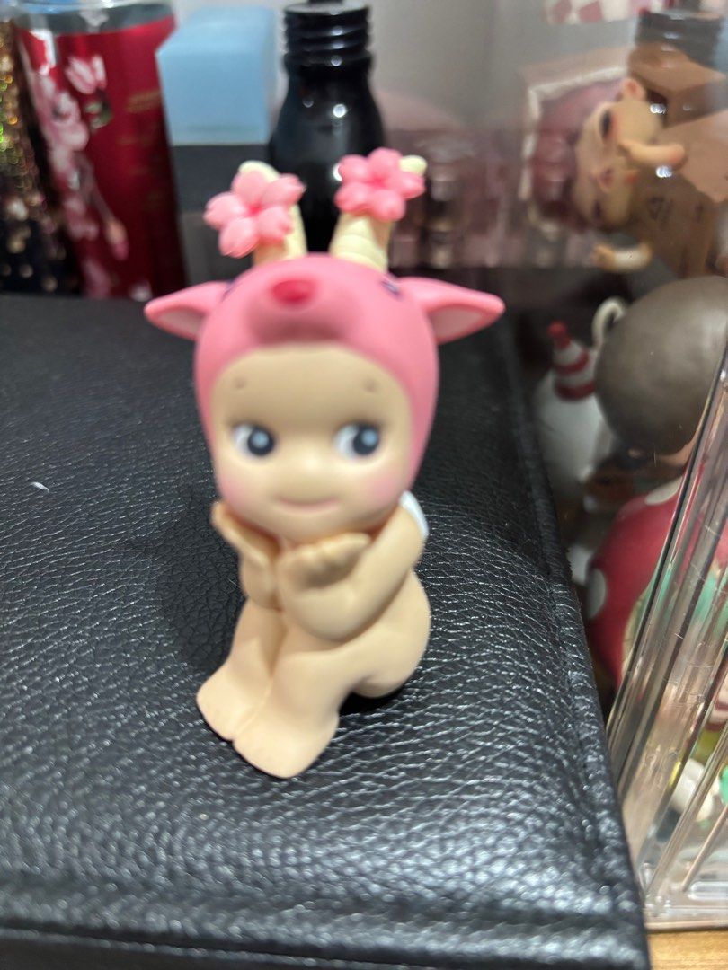 Sonny Angel Cherry Blossom Goat (Category: Designer & Blind Box Toys) located in Pasig City. Submitted by eracurates (Listing ID 1376759014, Image 2). Description: displaced in an acrylic box after opening.