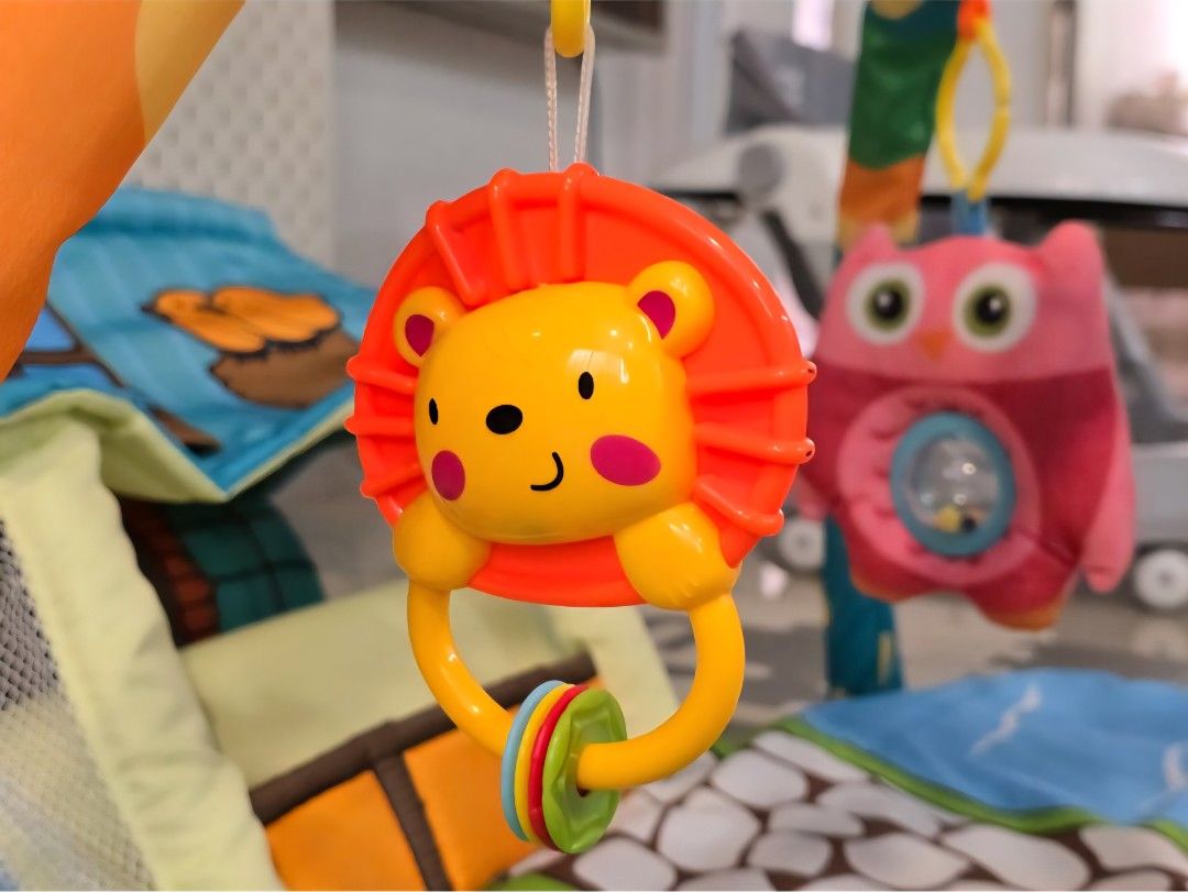 Baby Play Gym with Hanging Toys (Category: Infant Playtime) located in Singapore. Submitted by sim_ch (Listing ID 1376957812, Image 3). Description: Strictly self collection only. This colorful play gym features a soft mat with a whimsical design. Includes hanging toys like a star, lion, and owl to entertain your little one. Perfect for tummy time and playtime..