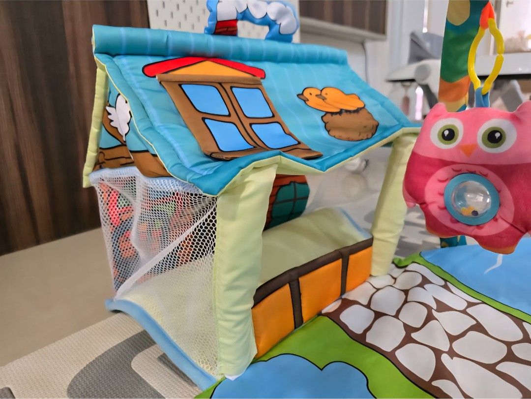 Baby Play Gym with Hanging Toys (Category: Infant Playtime) located in Singapore. Submitted by sim_ch (Listing ID 1376957812, Image 2). Description: Strictly self collection only. This colorful play gym features a soft mat with a whimsical design. Includes hanging toys like a star, lion, and owl to entertain your little one. Perfect for tummy time and playtime..