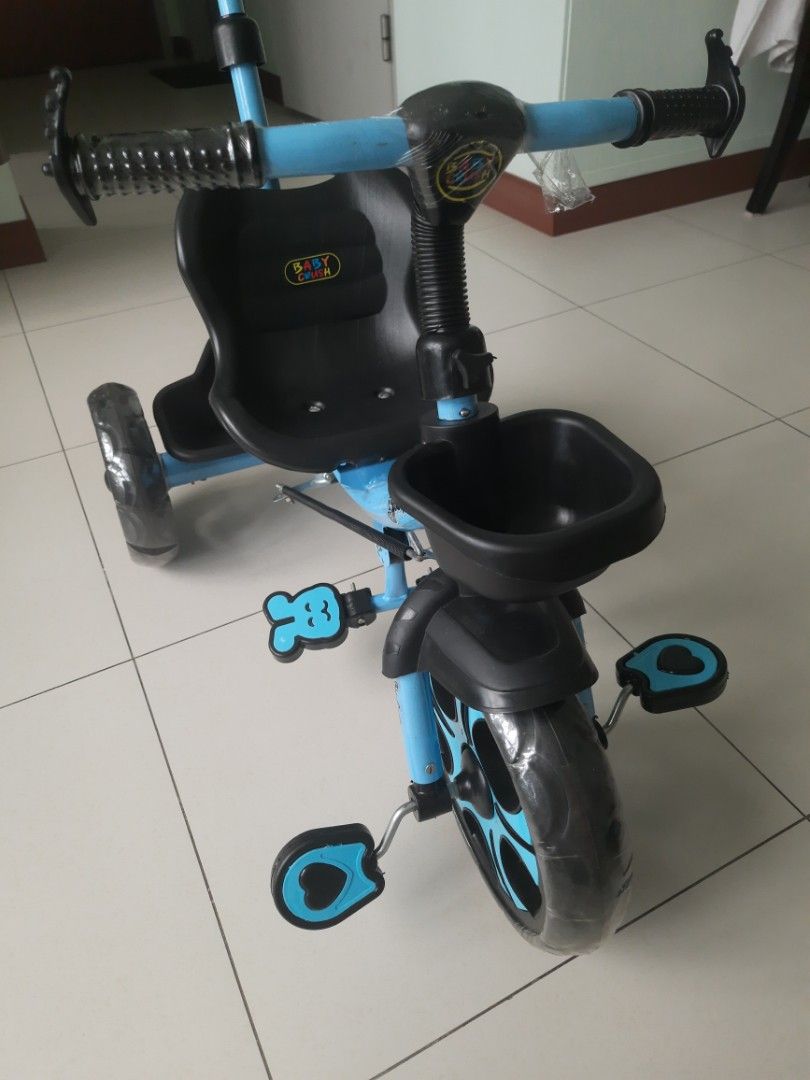 Baby Tricycle - Blue (Category: Other Babies Going Out Needs) located in Singapore. Submitted by shiv.st (Listing ID 1376906914, Image 2). Description: This children’s bicycle was received as a gift and used only twice indoors. It’s in excellent, like-new condition, with a parent control handle for added safety and guidance. Note : "The front wheel is slightly bent as shown in pic(likely from storage), but the bike is otherwise in perfect conditi