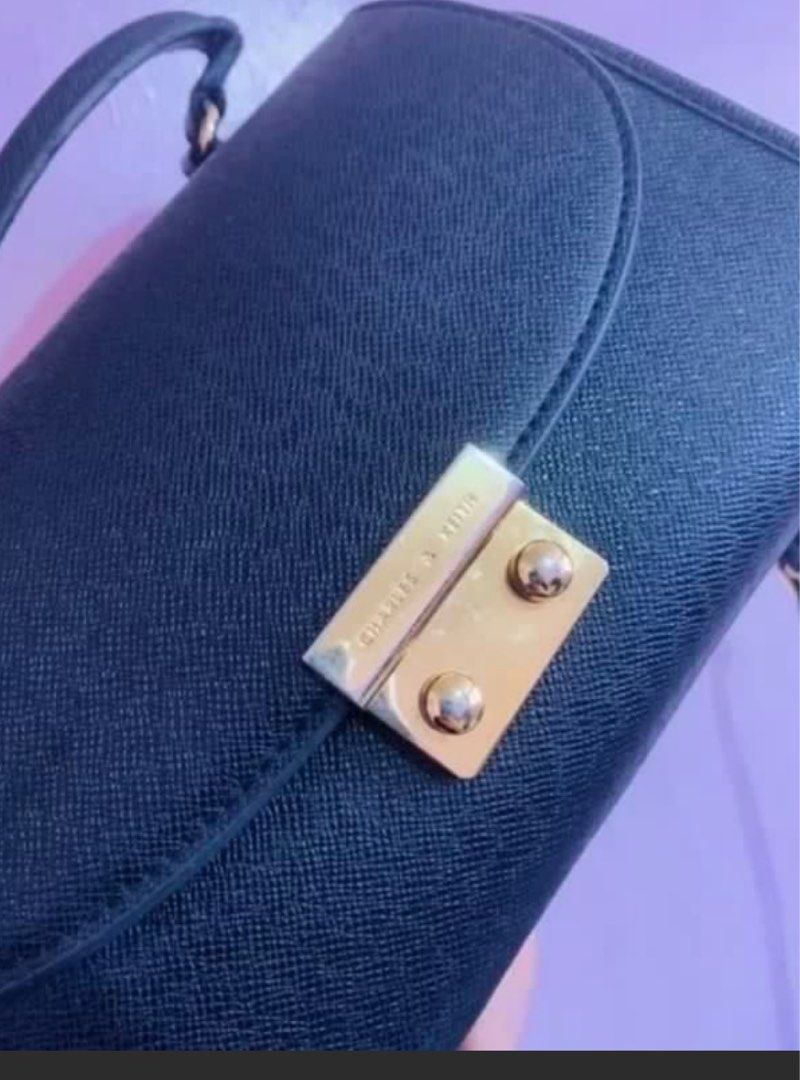 Charles & Keith Black Top handle and Sling bag (Category: Luxury Bags & Wallets) located in Quezon City. Submitted by impulsiveminimalist (Listing ID 1376980048, Image 2). Description: Used but not abused..