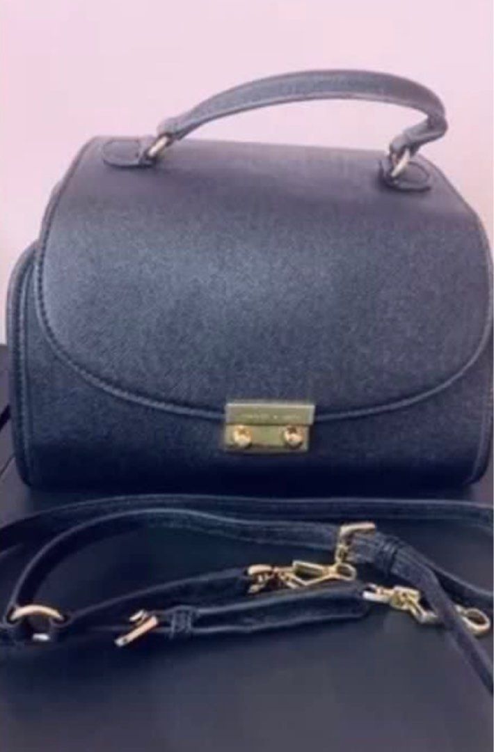 Charles & Keith Black Top handle and Sling bag (Category: Luxury Bags & Wallets) located in Quezon City. Submitted by impulsiveminimalist (Listing ID 1376980048, Image 3). Description: Used but not abused..