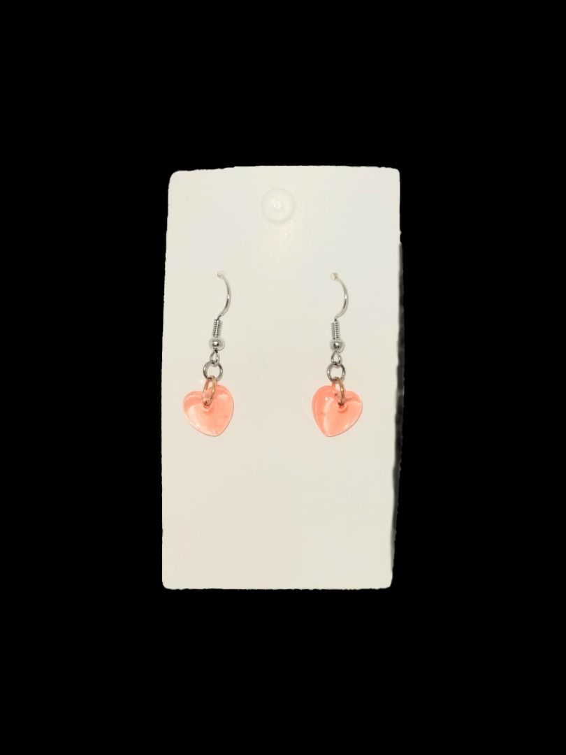 Heart-Shaped Red Resin Earrings (Category: Earrings) located in Singapore. Submitted by missdiystore (Listing ID 1376909818, Image 2). Description: These adorable earrings feature heart-shaped red charms. They are perfect for adding a touch of sweetness to any outfit. The earrings are lightweight and comfortable to wear. A great gift for yourself or a loved one!.