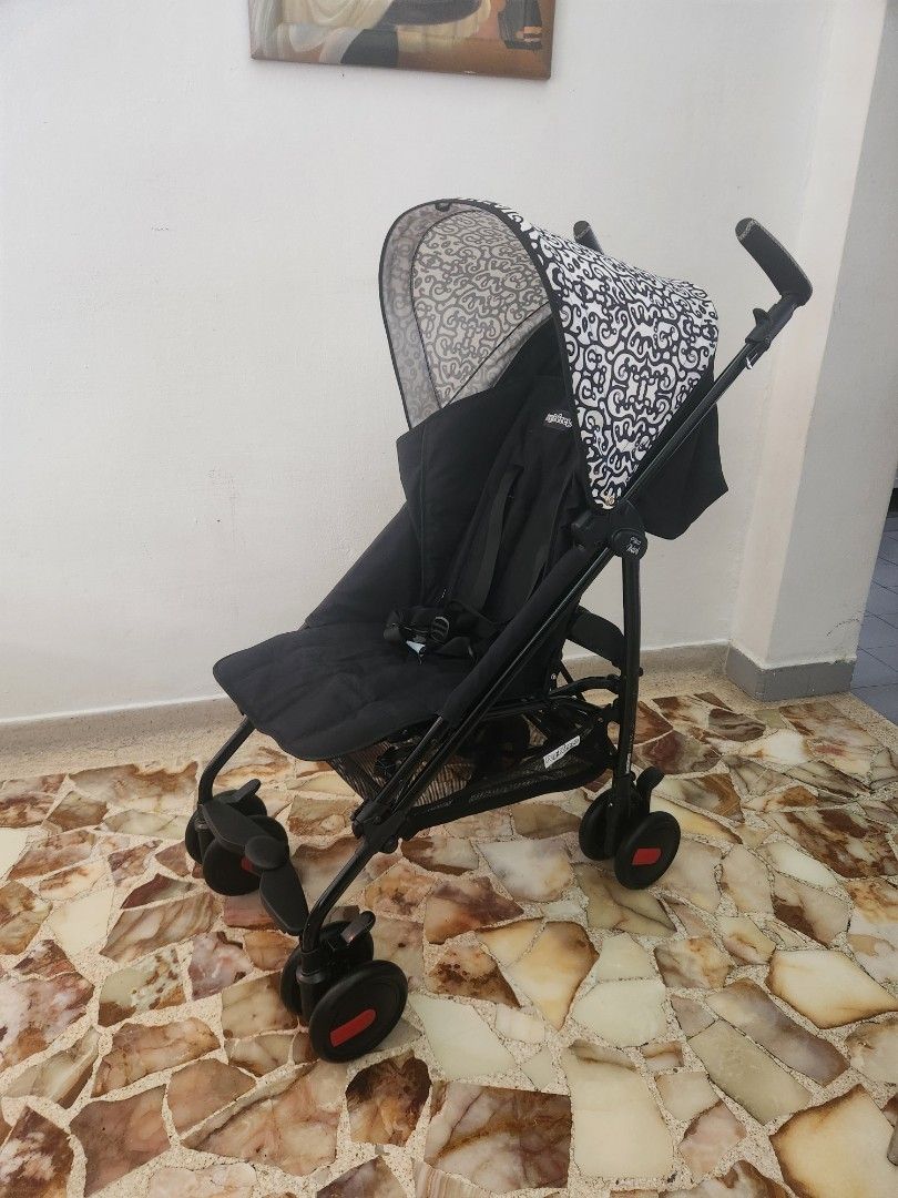 Pilko Mini Stroller - Made in Italy (Category: Strollers) located in Singapore. Submitted by xian_04 (Listing ID 1376838114, Image 2). Description: Pilko Mini stroller in excellent condition. Compact, lightweight, and travel-friendly. Features a stylish black and white canopy and patterned seat. Includes carrying bag and original box. Newborn up to 22kg with travel bag,seat linner & extra red canopy.