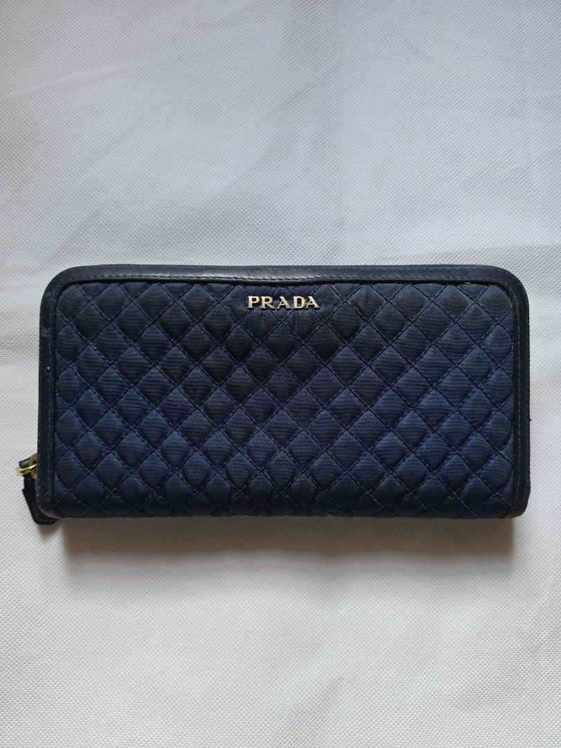 Prada Blue Quilted Nylon Tessuto Wallet (Category: Luxury Bags & Wallets) located in Manila. Submitted by buyn5ell (Listing ID 1376829619, Image 3). Description: Authentic from Europe 4.5 in. x 8 in. Complete with packaging and authenticity card Flaws shown in photos such as scuffs etc..
